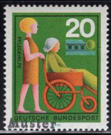 GERMANY(1970) Nurse Assisting Person In Wheelchair. MUSTER (specimen) Overprint. Scott No 1024. - Sonstige & Ohne Zuordnung