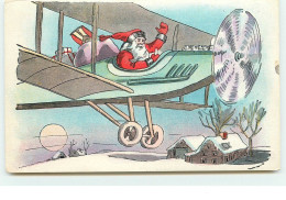 N°15294 - Père Noël Dans Un Avion Passant Au-dessus D'une Maison - Sonstige & Ohne Zuordnung