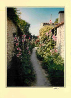 17 - Charente Maritime - Vieille Ruelle Bordée De Roses Trémières - Fleurs - CPM - Carte Neuve - Voir Scans Recto-Verso - Other & Unclassified