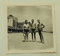 Three Naked Guys In Swimming Trunks On The Beach Of The Coast Of Venice - Personas Anónimos