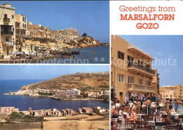 72457300 Gozo Malta Teilansichten Bucht Strassencafe Malta - Malta