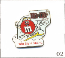 Pin’s Sport - J.O D’Albertville 1992 / Ski Acrobatique - Sponsor Chocolat M&M’s. Zamac Fin. T1009-02 - Olympische Spelen