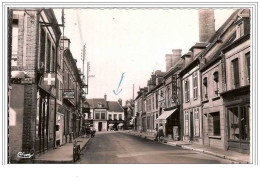 27.TILLIERES-SUR-AVRE.RUE  DE PARIS.PHARMACIE.PATISSIER .KODAKS.CAFE DU CENTRE, HOTEL.CPSM. - Tillières-sur-Avre