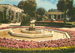 42 - Chambon-Feugerolles - Le Jardin Public - Fleurs - CPM - Voir Scans Recto-Verso - Autres & Non Classés