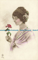 R627308 Woman With Brown Hair And Rose In Hands. G. P - World