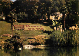 34 - Béziers - Le Jardin Des Poètes - Le Lac Des Cygnes - Parterre De Fleurs Buvez Du Vin - CPM - Voir Scans Recto-Verso - Beziers