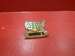 PIN'S " WINN'S ". - Autres & Non Classés