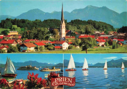 73978968 Prien_Chiemsee Ortsansicht Mit Kirche Chiemgauer Alpen Segeln Faehre - Autres & Non Classés