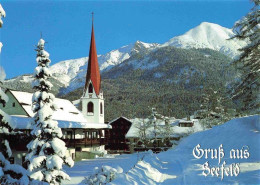 73978944 Seefeld_Tirol Gotische Pfarrkirche St. Oswald Schigebiet Rosshuete Im W - Autres & Non Classés
