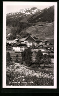 AK St. Anton A. Arlberg, Ortsansicht Mit Bergpanorama  - Sonstige & Ohne Zuordnung