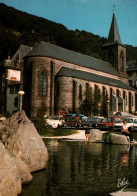 CPM - Le MONT DORE - Le Nouveau Bassin L'église (voitures) - Edition L.Chatagneau - Le Mont Dore