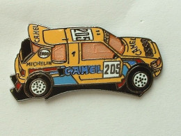 Pin's PEUGEOT 205 DAKAR - ESSO - CAMEL - MICHELIN - DEMONS & MERVEILLES - Peugeot