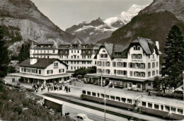13960819 Grindelwald_BE Mit Bahnhofplatz Mit Finsteraar Und Fiescherhorn - Autres & Non Classés