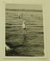 A Boy Is Standing In Shallow Water - Anonymous Persons