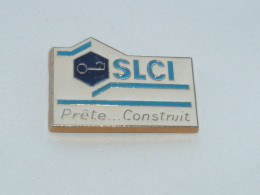 Pin's AGENCE IMMOBILIERE SLCI, PRETE ET CONSTRUIT - Other & Unclassified
