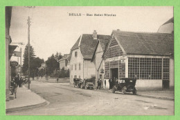 A184  CPA  DELLE (Territoire De Belfort)   Rue Saint-Nicolas - AUTO-GARAGE A. MUHOT- Cycles Réparations - Location Trans - Delle