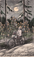 1900-Buon Natale Simboli Augurali (angelo Su Bicicletta E Abeti Addobbati), Cart - Other & Unclassified