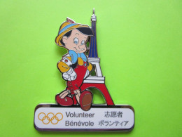 Gros Pin's BD Pinocchio Bénévole JO Jeux Olympiques Tour Eiffel Paris (5X6,5cm) - #672 - Coca-Cola