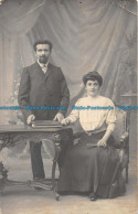 R161429 Old Postcard. Woman With Man Near The Table. R. Guilleminot - Monde