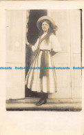 R163315 Old Postcard. Woman Near The Doors - World