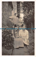 R164542 Old Postcard. Family Photo Near The House - World