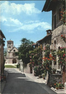 72287993 Assisi Umbria Strassenpartie Mit Kirche Firenze - Autres & Non Classés