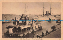 R676891 The Suez Canal. Crossing A Dredger. The Oriental Commercial Bureau - World