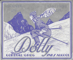 DOLLY CORDIAL GROG SANS ALCOOL - UNE SKIEUSE, MONTAGNE, ETIQUETTE ANCIENNE MAISON FORIEZ HOUZE HAILLICOURT PAS DE CALAIS - Altri & Non Classificati