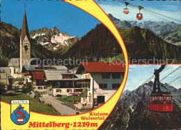 71708880 Mittelberg Vorarlberg Dorfstrasse Kirche Kabinenbahn Alpenpanorama Klei - Sonstige & Ohne Zuordnung