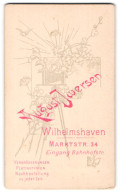 Fotografie August Iwersen, Wilhelmshaven, Marktstr. 34, Plattenkamera Auf Dreibein Mit Blumen  - Personnes Anonymes