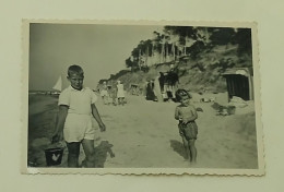 Little Girl And Boy On The Beach - Anonymous Persons