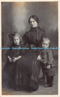 R178688 A Woman And Two Kids. Postcard. Photo - World