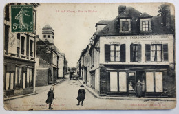 CPA 61 LE SAP - Rue De L'église - Personnages - Commerce Papiers Peints Peinture Voitures -1912 - Sonstige & Ohne Zuordnung