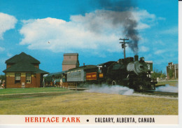 Heritage Park Calgary Alberta Canada Steam Locomotive 6269 Leaving The Shepard Station Shants Grain Elevator.  2sc - Calgary