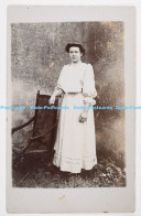 C001551 Woman In A Long Dress Stands Near A Chair. Portrait. 1909 - Monde