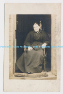 C001213 Woman. Sitting On A Chair - World