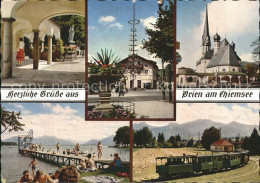 72257161 Prien Chiemsee Marktbrunnen Maibaum Kirche Schwimmbad Prien - Andere & Zonder Classificatie