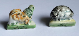 Fève Fables De LA FONTAINE Lot De 2 Fèves Le Loup Et L'Agneau Le Lièvre Et Le Tortue - Animals