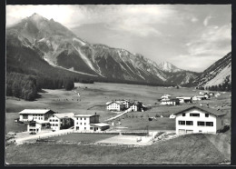 AK Tschierv, Ortsansicht Mit Gasthaus Sternen Und Schulhaus Mit Pitz D`Aint Und Ofenpass - Tschierv