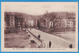 Delcampe - CPA HERAULT (34) - BEDARIEUX - LE PONT VIEUX RAJEUNI ET ENTREE DE LA RUE SAINT-LOUIS - Bedarieux