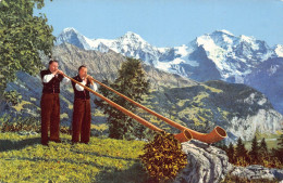 A759 Switzerland Alphornblaeser Mit Eiger Moench Jungfrau Ethnic Horn Postcard. - Ohne Zuordnung