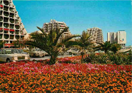 Automobiles - La Grande Motte - Parterre De Fleurs Sur L'Avenue Auguste Monier - CPM - Voir Scans Recto-Verso - Toerisme
