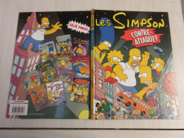 BD Les SIMPSON 12 CONTRE-ATTAQUE ! - Matt Groening - 2010 - Editions Jungle - Lucky Luke