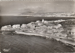 Delcampe - ALGERIE. MOSTAGANEM (ORAN). CPA.VUE PANORAMIQUE AERIENNE DE "LA SALAMANDRE ". DANS LE FOND MOSTAGANEM. TEXTE ANNÉE 1954 - Mostaganem