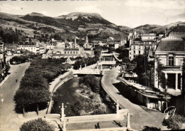 Delcampe - CPSM La Bourboule Puy De Dome La Dordogne Dans Sa Traversee De La Ville Au Fond Le Puy Gros - La Bourboule