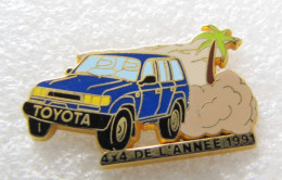Delcampe - PIN'S   TOYOTA  LAND CRUISER  STATION WAGON 4X4 De L'année  ARTHUS BERTRAND - Toyota