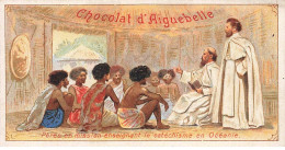 Delcampe - CHROMO #CL30987 CHOCOLAT D AIGUEBELLE PRETRES MISSIONNAIRES CATECHISME HABITATION TRADITIONNELLE OCEANIE - Aiguebelle