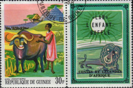 Delcampe - Guinee (Rep) Poste Obl Yv: 358 Mi:483 Lan L'enfant-bufle (TB Cachet Rond) Avec Vignette - Vacas