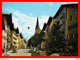 Delcampe - CPSM/gf  KITZBÛHEL (Autriche)  Vorderstadt Mit Katharinen-Kirche Gegen Süden, Animé, Commerces. *3081 - Kitzbühel